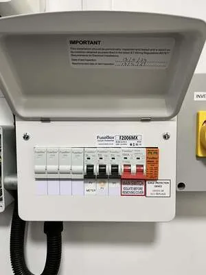 Consumer unit with surge protection and a labelled PV circuit beside a solar isolator