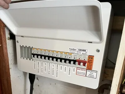 New consumer unit with labelled circuit breakers and a surge protection device