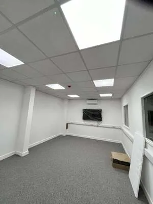 Office fit-out with recessed LED panel lighting in a suspended ceiling