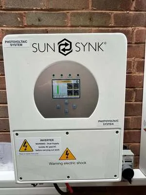 Sunsynk hybrid solar inverter mounted on an exterior wall