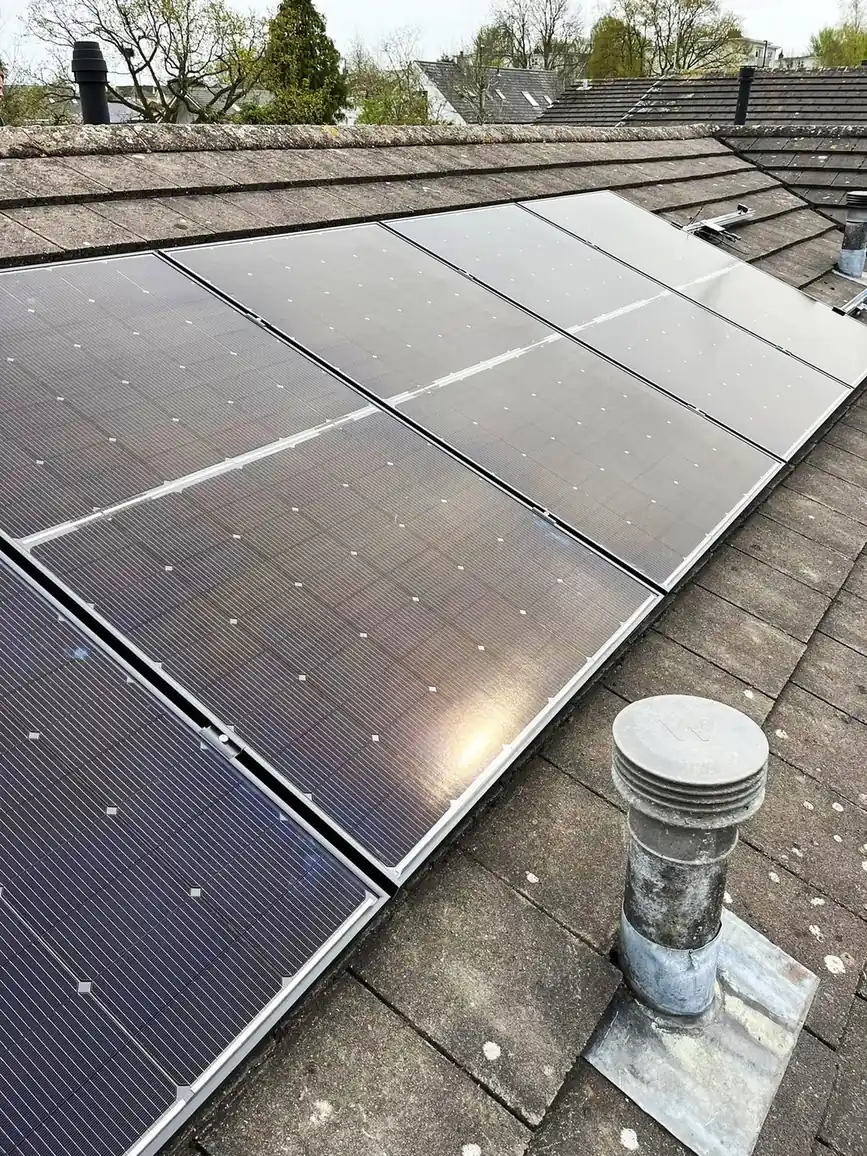 Black solar PV panels on a tiled roof